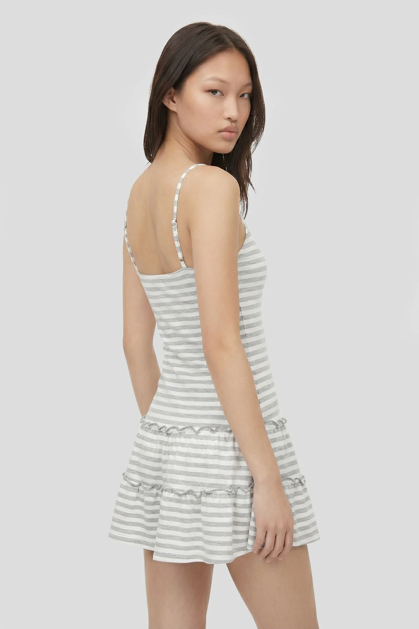 2030-striped-v-neck-tiered-mini-dress-5.webp Striped V-Neck Tiered Mini Dress